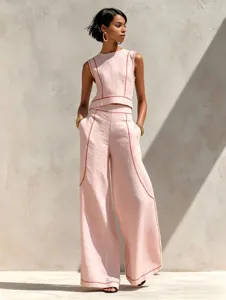 Chic pink sleeveless top and wide leg pants set with contrast stitching, stylish casual two-piece.