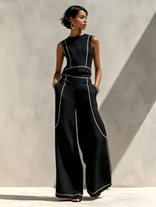 Stylish black sleeveless top and wide-leg trousers set with contrast piping details.