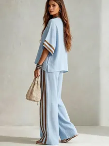 Casual linen two-piece set detail view, featuring contrast stripes and loose wide-leg pants design.