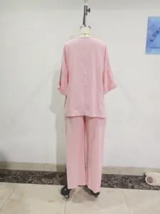 Casual pink two-piece loose lounge set with comfortable top and matching long pants.