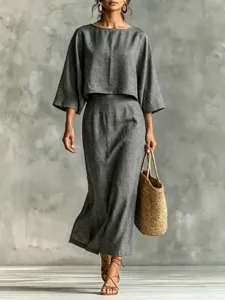Close-up detail of the elegant grey linen blend two-piece set, featuring loose top and skirt.