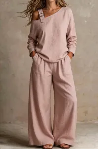 Detailed view of the stylish mauve two-piece set featuring asymmetrical strap and wide-leg.