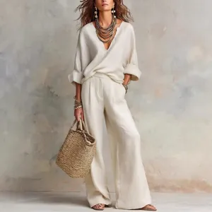 Detailed view of casual linen two-piece set featuring loose V-neck top and wide-leg trousers.