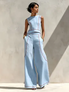 Detailed shot of light blue sleeveless crop top and wide-leg trousers matching set.