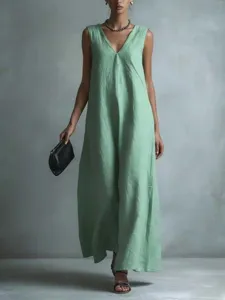 Detailed view of the light green sleeveless maxi dress, showcasing elegant drape and V-neck.