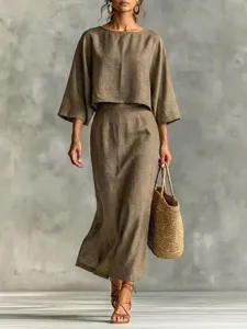 Detail view of the elegant brown linen two-piece set featuring a loose top and high waist skirt.