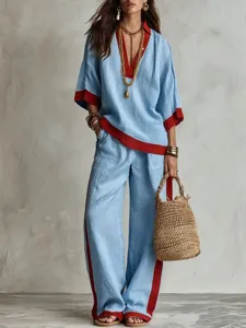 Completo autunnale alla moda con scollo a V, maniche corte e pantaloni larghi casual.