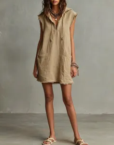 Close-up detail view of the sleeveless hooded mini dress featuring raw edges and pockets.