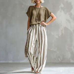 Casual women's outfit set featuring a round neck short sleeve top and striped wide leg pants.