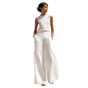 Chic women's two-piece set featuring a sleeveless top and wide leg pants with contrast stitching.