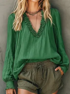 Women green V-neck long lantern sleeve blouse french style casual chic shirt top detail view.