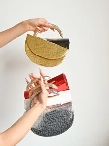 Snake pattern semi-circular evening clutch bag with metallic snake handle for women fashion.