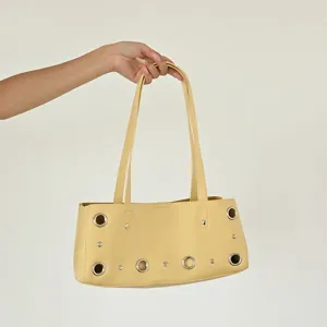 Yellow shoulder bag with metal grommets and rivets detail casual chic tote purse daily use
