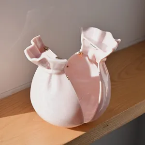 Pink marble evening lucky bag detail, elegant ruffle pouch purse with gold clasp hardware.