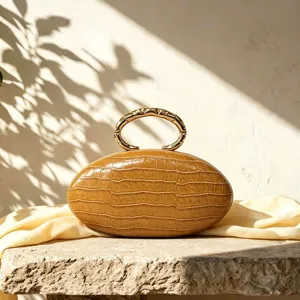 French luxury oval clutch bag with PU crocodile texture and metal handle for women.