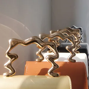 Spring new design casual solid color fashion trendy small square bag with irregular metal handle