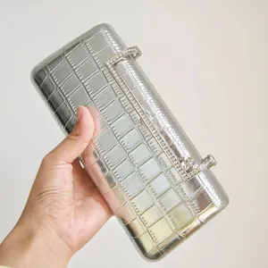 Silver metallic crocodile textured evening clutch with sparkling rhinestone clasp for women party.