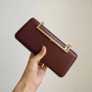 Elegant burgundy evening clutch with sparkling rhinestone metal clasp for women parties.