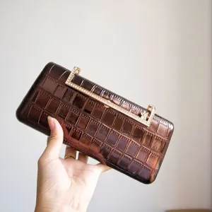 Exquisite retro rhinestone metal clasp evening clutch bag, luxury shiny party handbag detail.