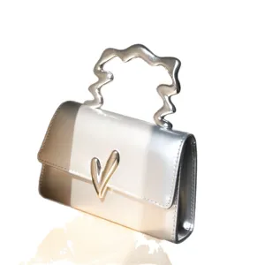 Spring summer metallic gradient small square handbag with unique irregular wavy handle.