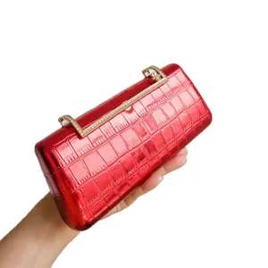 Red vintage rhinestone metal clasp evening clutch bag, elegant and sparkly dress accessory.