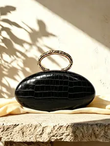 French luxury oval PU leather clutch bag with elegant metallic ring handle for evening party.