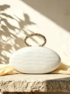 French luxury white oval clutch bag with crocodile texture and gold metal ring handle.