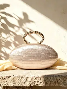 French luxury oval clutch bag with premium PU crocodile texture and chic metal handle for women.
