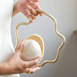 French niche evening bag with irregular metallic handle and pearl egg shell design for women