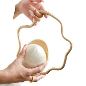 French style irregular evening bag with metal cloud handle and pearlescent eggshell design.