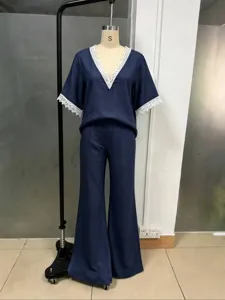 Blue cotton linen two-piece set featuring a V-neck lace short sleeve top and wide leg pants.