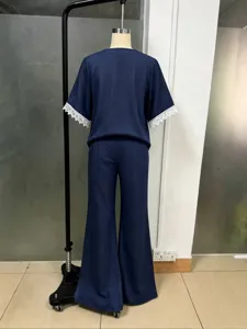 Women summer casual two piece set short sleeve top and wide leg pants with lace trim.