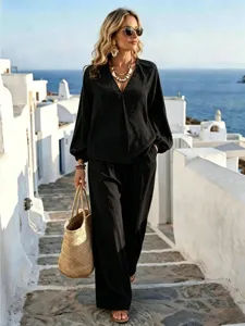 Resort style two-piece long sleeve shirt and loose pants set, elegant casual fashion detail.