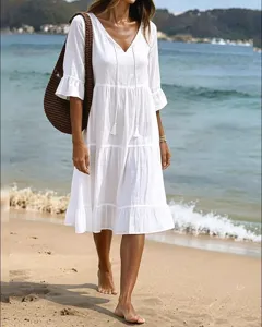 Women white V-neck tiered beach midi dress with ruffle sleeves and tassel drawstring style.