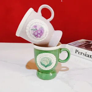 Vintage high foot ceramic mug with exquisite lace relief and floral pattern for coffee or tea.