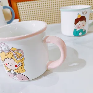 Cute ceramic couple mug set with sweet cartoon girl and boy design for student breakfast.