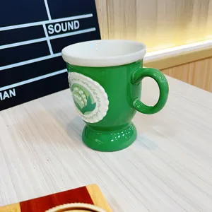 Retro ceramic coffee mug with green and white lily of the valley relief pattern for home use.