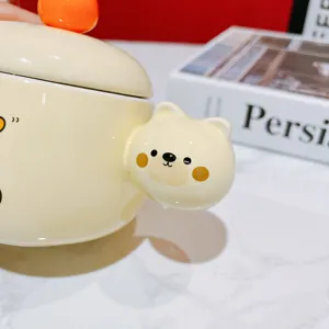 Cute ceramic coffee mug with adorable bear design and lid, perfect gift detail view.