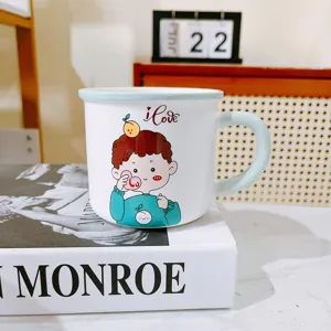 Close-up detail of the cute ceramic cartoon boy mug displayed on a stylish desk setup.