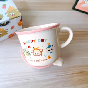 Cute ceramic mug detail featuring adorable cartoon animal prints, ideal for breakfast and daily drinks.