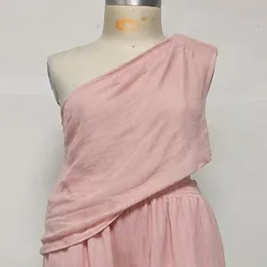 Detailed view of the pink one-shoulder top and wide-leg trousers casual clothing set.
