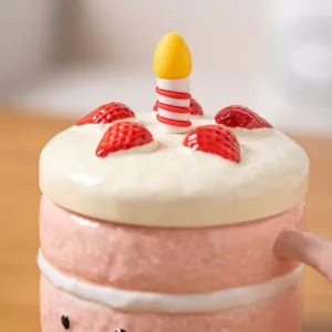 Cute ceramic cake mug with strawberry and candle lid design for breakfast and coffee. Perfect sweet gift.