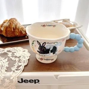 Creative cute ceramic coffee mug with high base and blue bubble handle, lovely rabbit pattern.