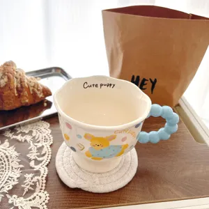 Cute ceramic mug with puppy design and blue bubble handle, ideal for daily coffee or milk use.