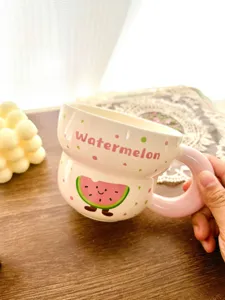 Cute ceramic mug with watermelon cartoon design and pink handle, great for daily coffee or milk drinks.