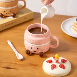Close-up of a cute dessert ceramic coffee mug featuring a sweet face, lid and spoon pouring milk.