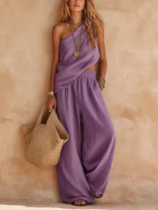 Chic purple two-piece linen set featuring a stylish one-shoulder top and loose wide-leg pants.