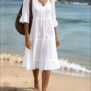 White tiered beach dress with V-neck and drawstring, elegant casual midi dress for women.