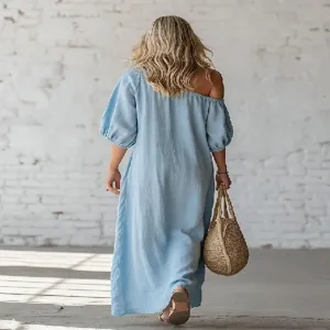 Detailed view of women casual light blue off-shoulder maxi dress with puff sleeves for vacation.