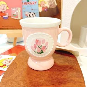 Pink ceramic coffee mug featuring beautiful tulip relief design for elegant daily home use.
